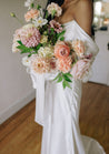Bride holding a Chelle bridal bouquet