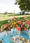 Colorful Wylder collection centerpieces on an outdoor table setting